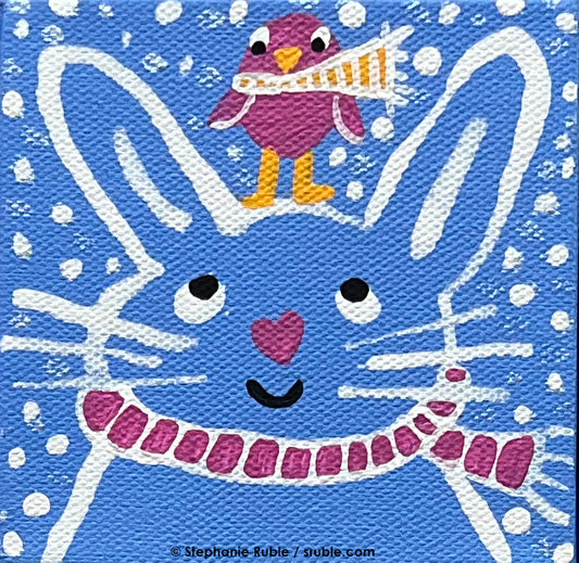 small square light blue painting with a white line art bunny wearing a pink striped scarf, with a pink heart nose. there's a pink bird with a yellow striped scarf standing on the bunny's head and there's snow in the background